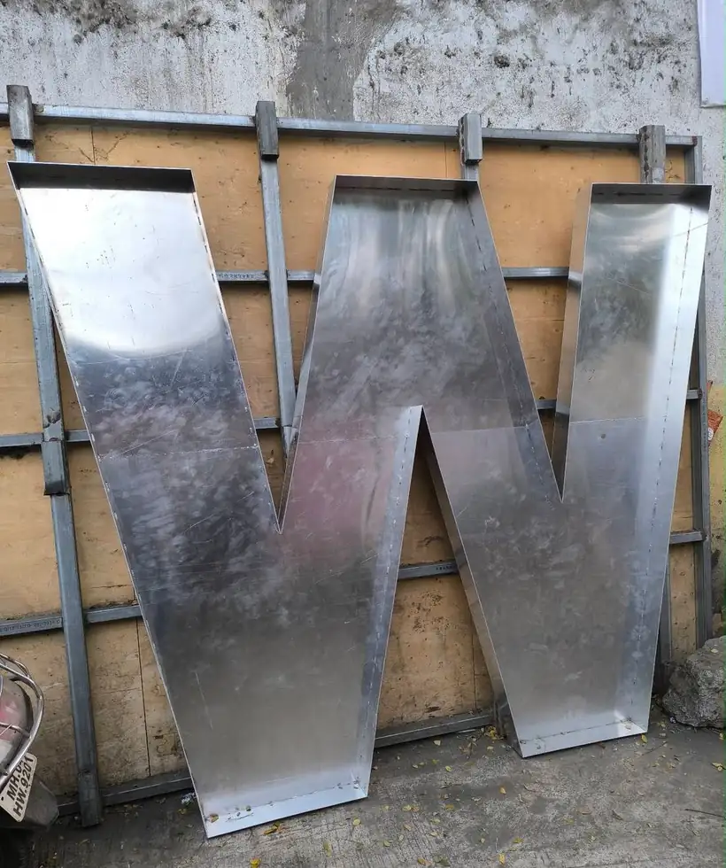 Large fabricated aluminium letter W in the workshop