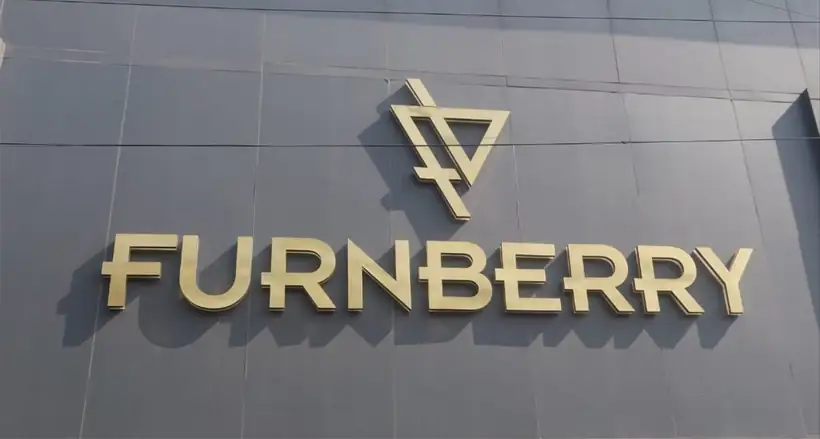 Gold finish metal letters fixed to a grey ACP fascia
