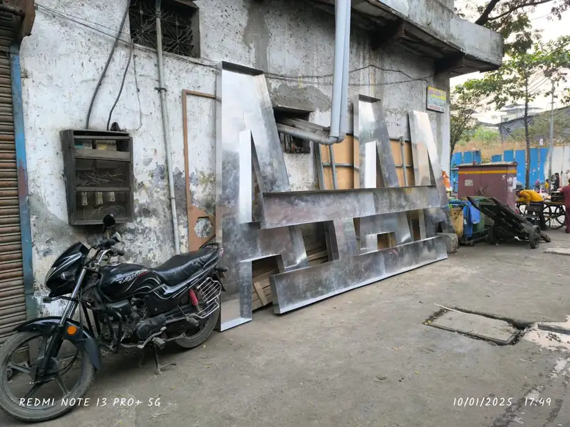 Oversized stainless steel signage letters ready for transport