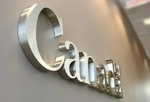 Stainless steel mirror finish letters mounted on a wall